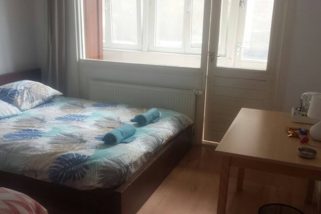 first room: double bed and single bed. big window and terrace