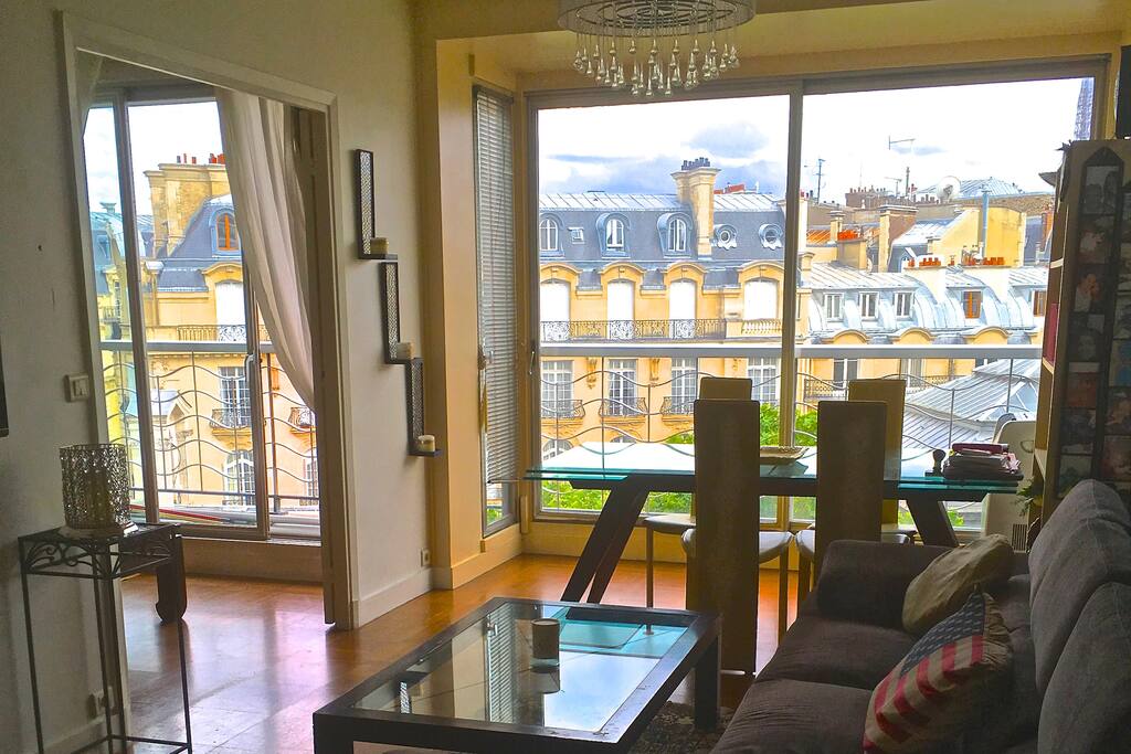 living room with dining area and view