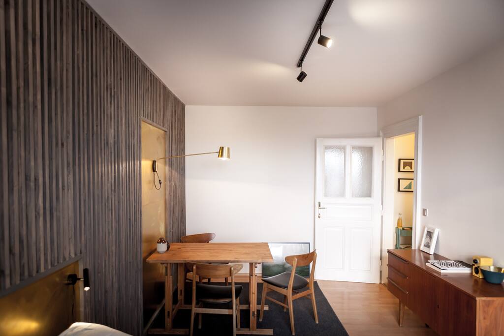 The interior is a combination of modern furniture and vintage pieces.