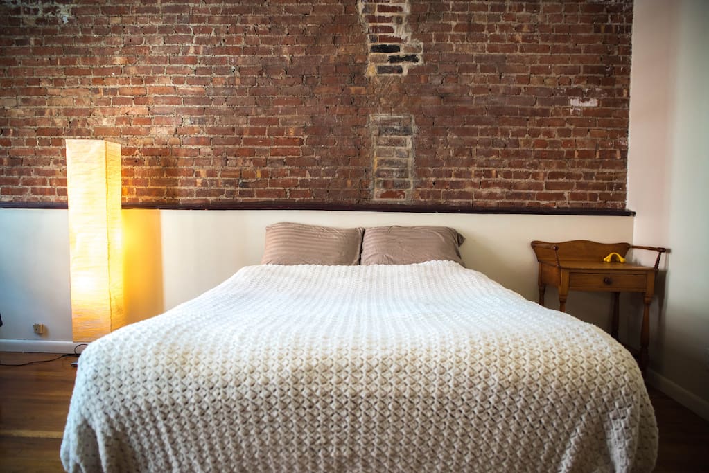 Queen bed with hand-woven bed spread