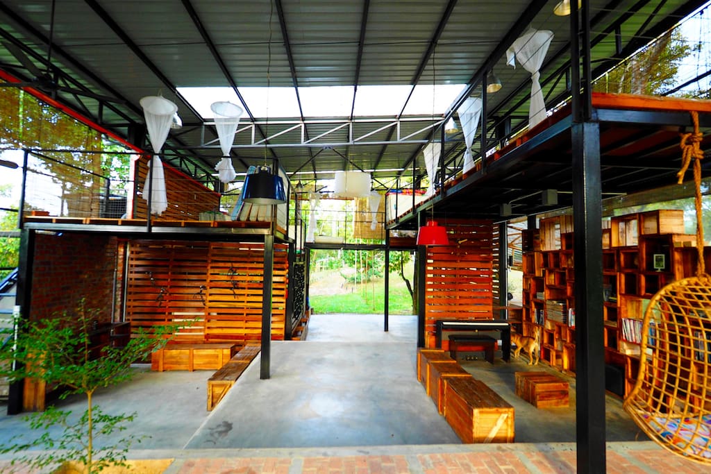 The Cube - Living space with reading corner, piano and audio system (Music)