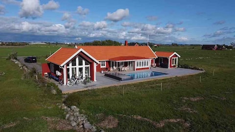 Exclusive halland sledding by the sea with hot pool!