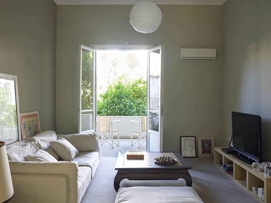 Dining area and living room fully equipped with wireless internet and flat screen TV.