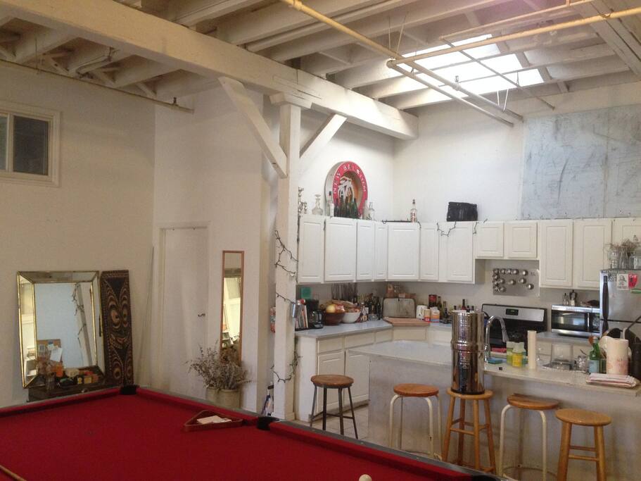 Fully equipped kitchen with washing machine, oven and microwave.