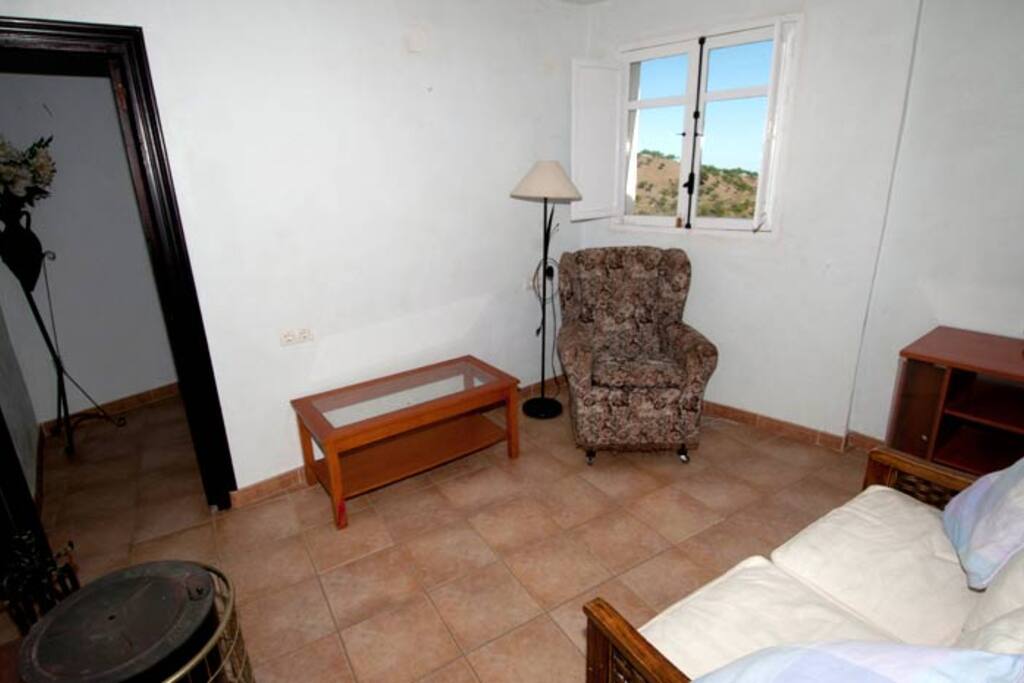 Lounge area. Picture no: 1 Seating for three. Wood burn stove.