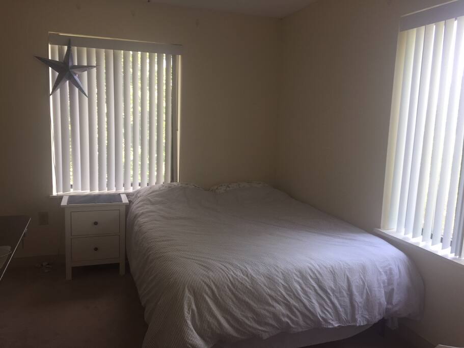 The queen-size bed sleeps two people