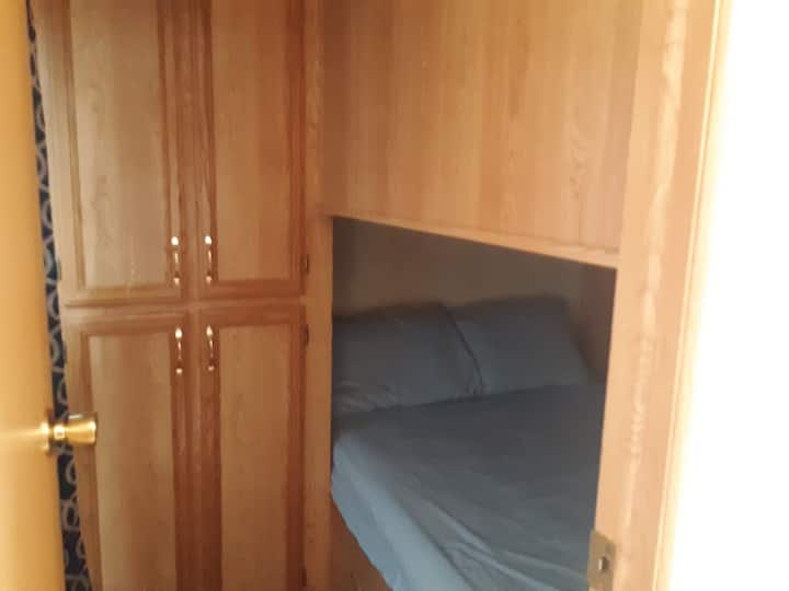 Bedroom 2 with double bed, lower bunk style.