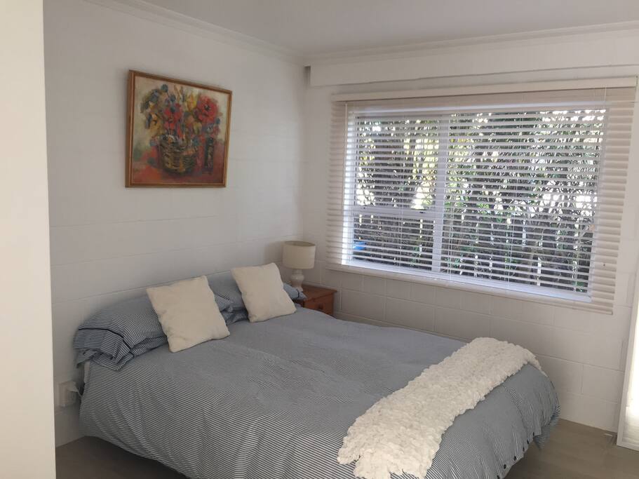 Spacious bedroom with a Queen bed