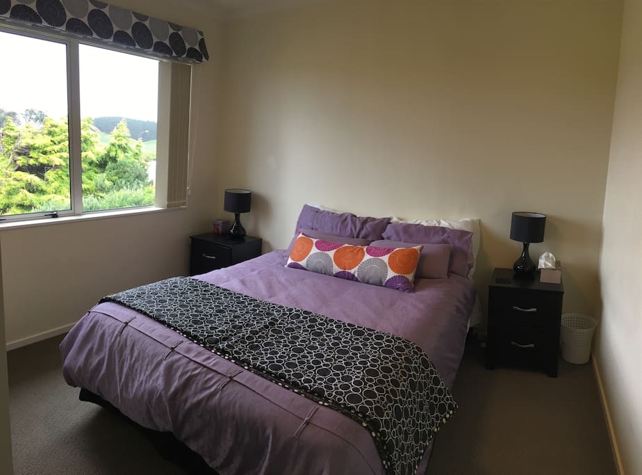Large double room with luggage rack and storage