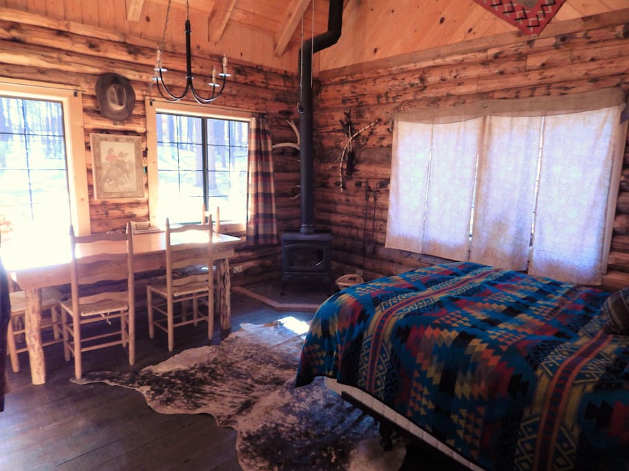 Main room with queen bed and dinner table