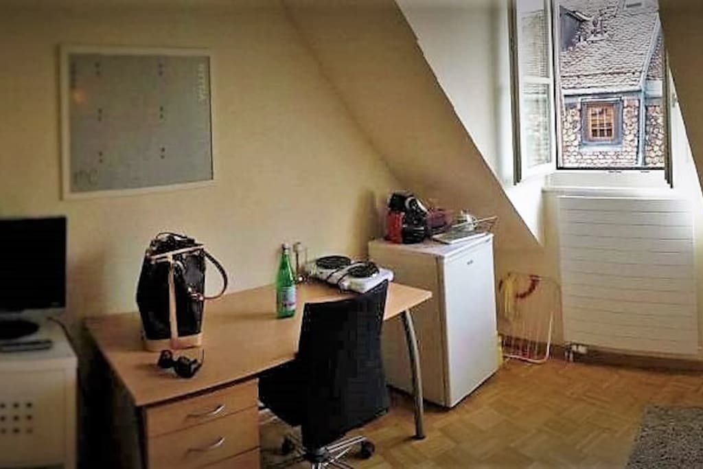 A perfect place for your laptop near the window.