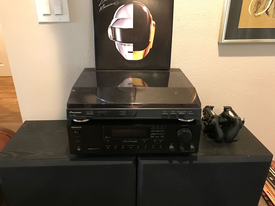 Record player with an assortment of records! Fills the house with awesome tunes.