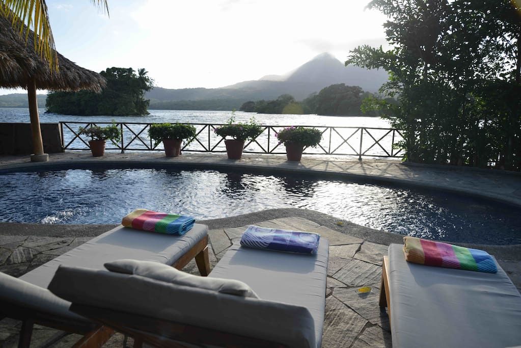 Relax at the pool with a mesmerizing view of Volcano Mombacho!Fun Fact: Volcano Mombacho erupted thousands of years ago and formed Isla Bella!!! 