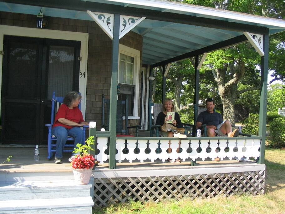 Enjoy our spacious porch. Take a peek of the beach!