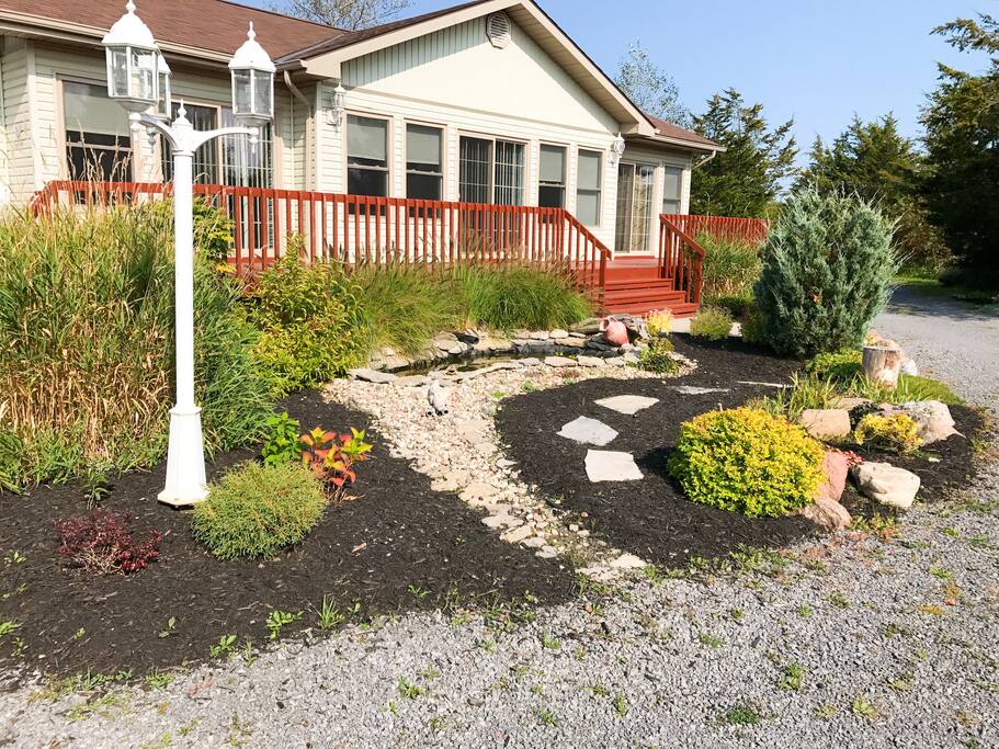 Beautiful Landscaping surrounds the deck