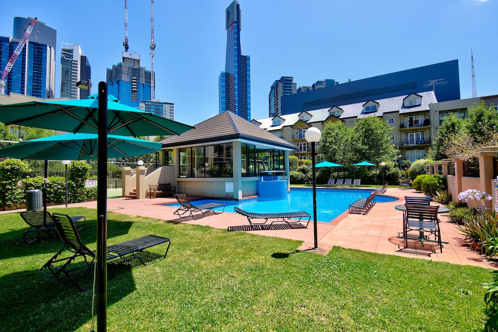 The outdoor pool is solar heated and has a hot spa