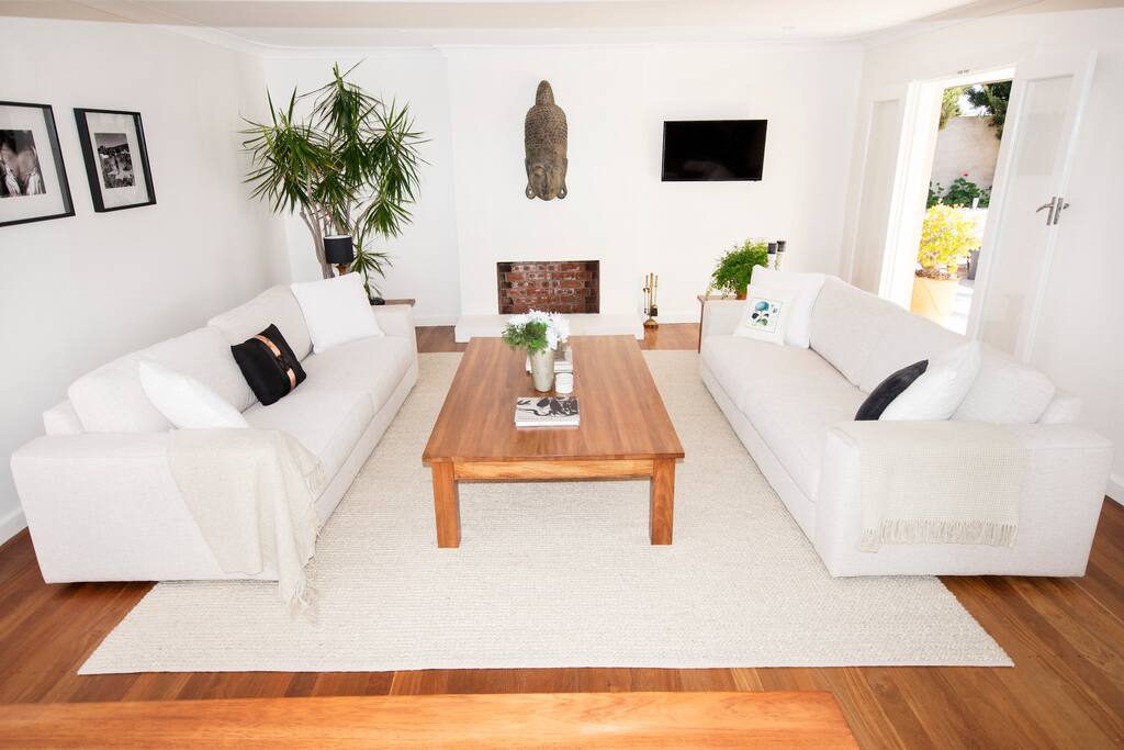 The comfortable lounge area has French doors that open to the top terrace and afternoon breeze.