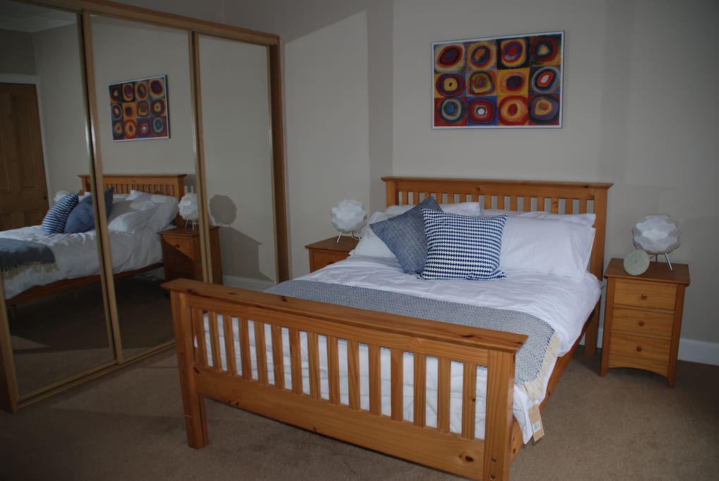 Large bright, spacious double bedroom with fitted wardrobe and chest of drawers