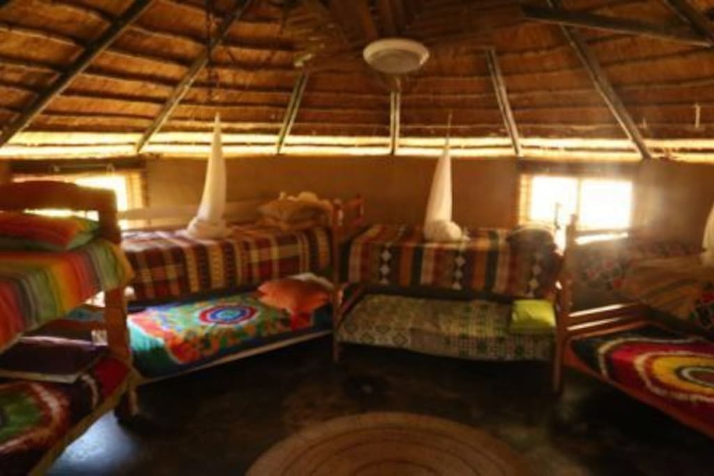 Wakka Wakka Dormitory – Typical Zulu mud hut/rondavel. Sleeps 12 in 6 bunk beds. Ablutions shared. Own braai area, mini bar fridge. Or communal kitchen/braai area