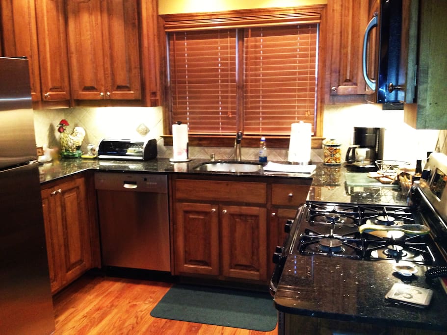 Granite counter tops and a gas stove and microwave. Coffee maker, coffee, cream and sugar. And, fully stocked with practically everything you'll need.