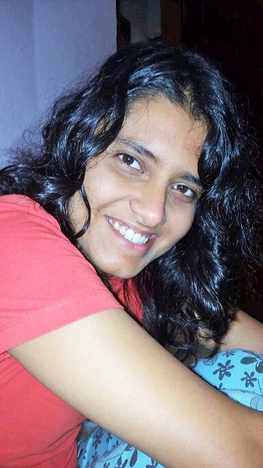Sangha relaxing in her bed room at AFrica Treasure Home