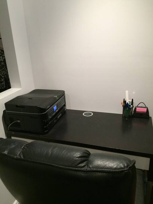 office area with desk and comfy chair