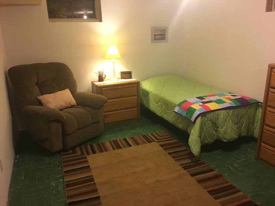 The bedroom is in the basement. It is new. There is also a pingpong table and a tv down in partially finished basement. There is also a half bath there.