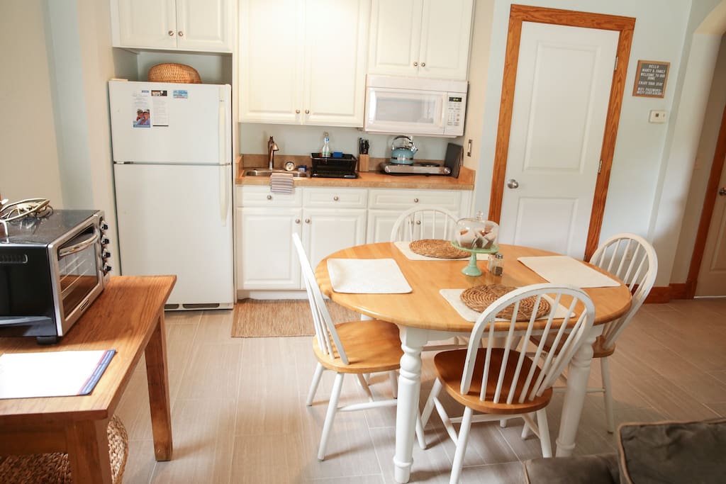 Kitchenette with refrigerator, microwave, KitchenAid toaster oven, & double hot plate.