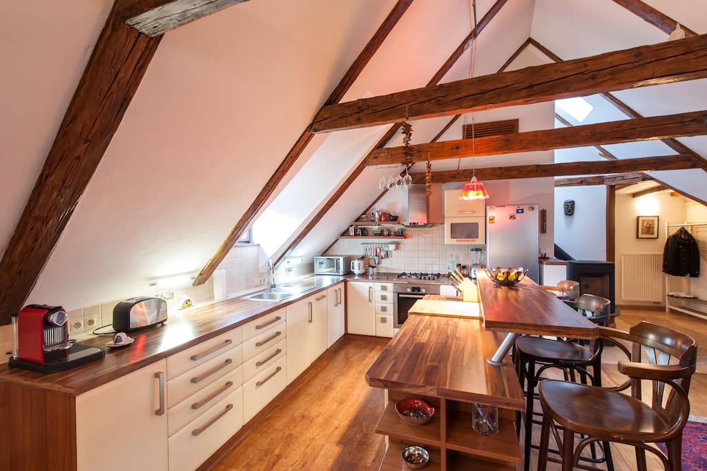 Open space kitchen under neath the 15th century truss