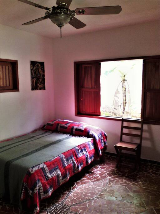 Newly tiled mosaic floor, with ceiling fan.