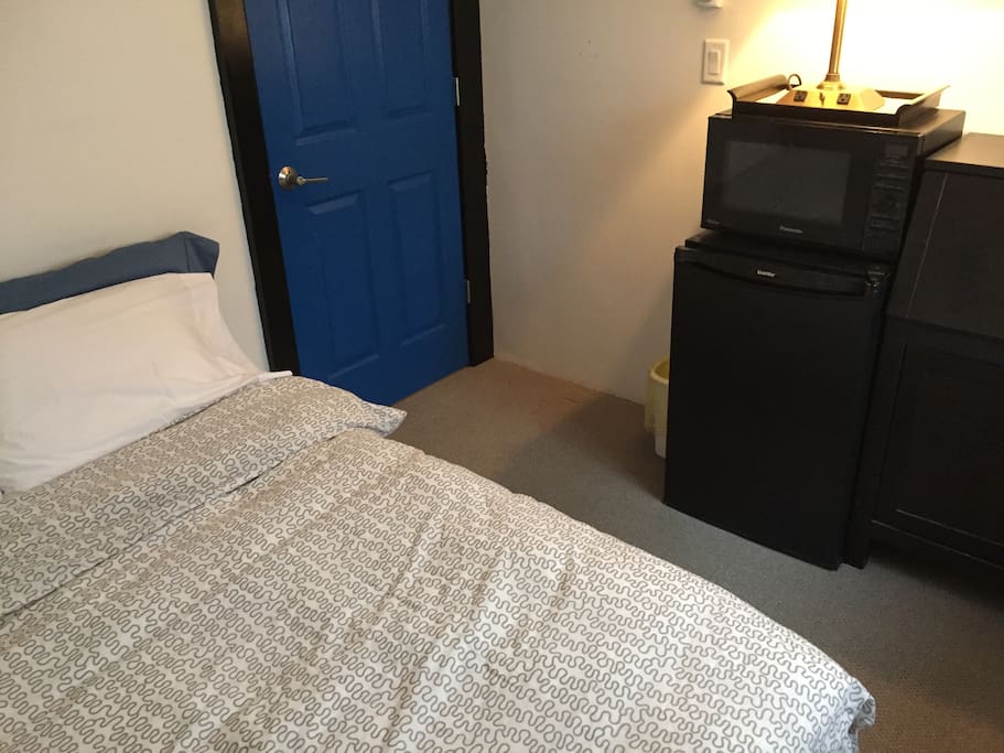 Mini fridge microwave toaster dishes and kettle provided in room as well as towels and clean sheets