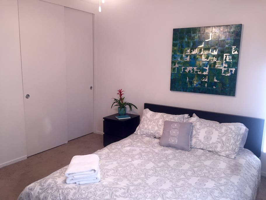 Large closet w/ iron and ironing board