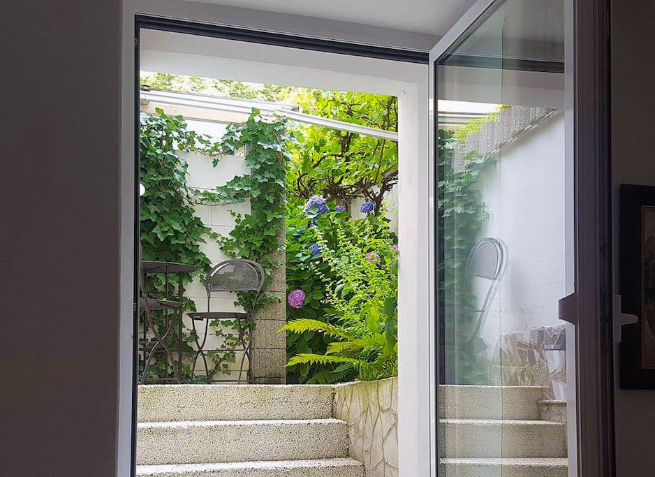 Direct exit to the courtyard and summertime!