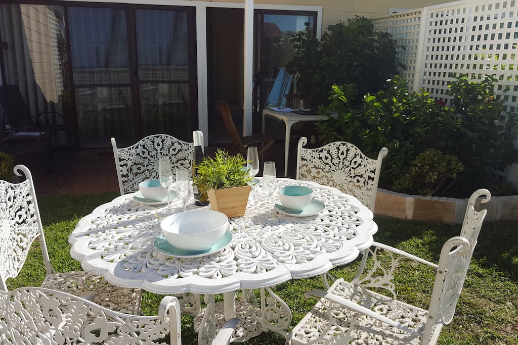 Host friends or family by the ocean in your private garden