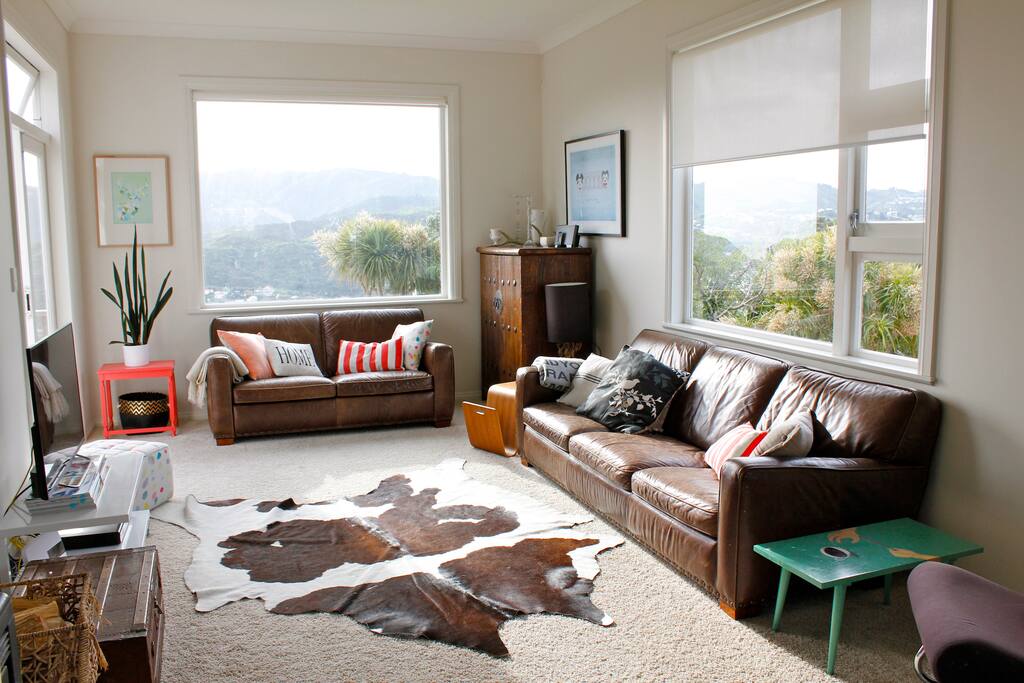 Living room, with double doors to sunny west facing deck