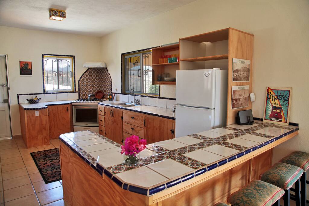 full kitchen with island and stools