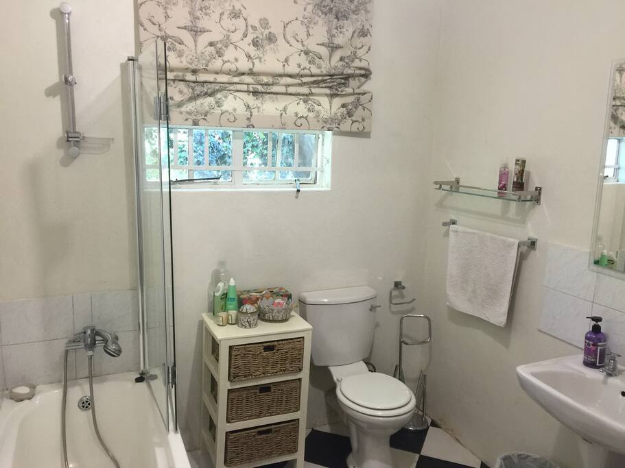Bathroom with bath and shower