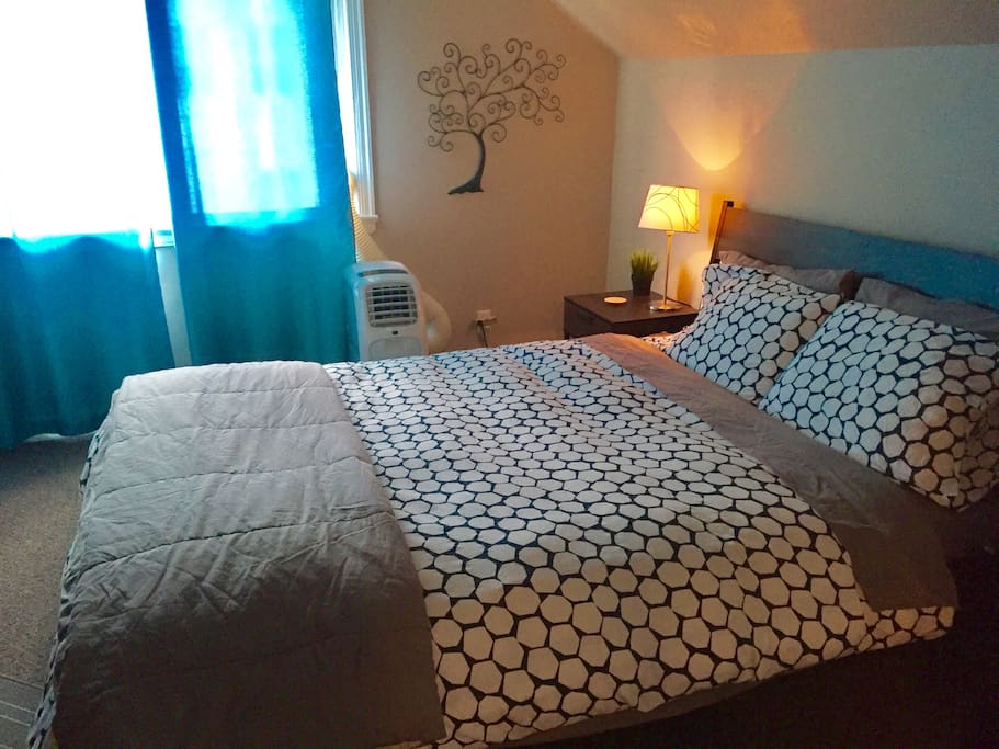 Comfortable bed with plenty of extra pillows and blankets!