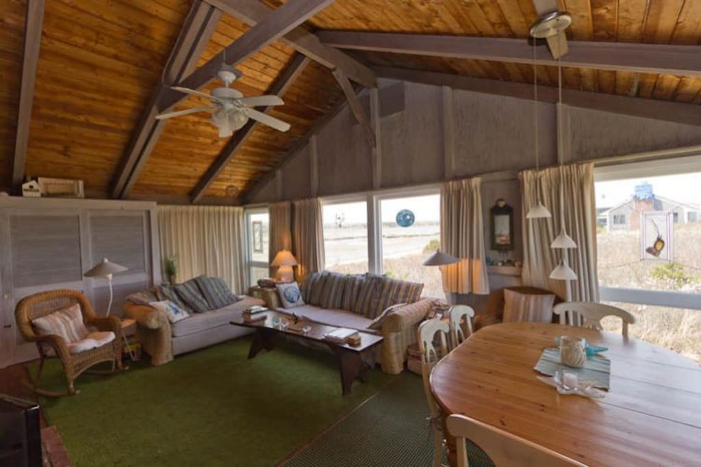 Lovely living room with high ceilings and lots of windows