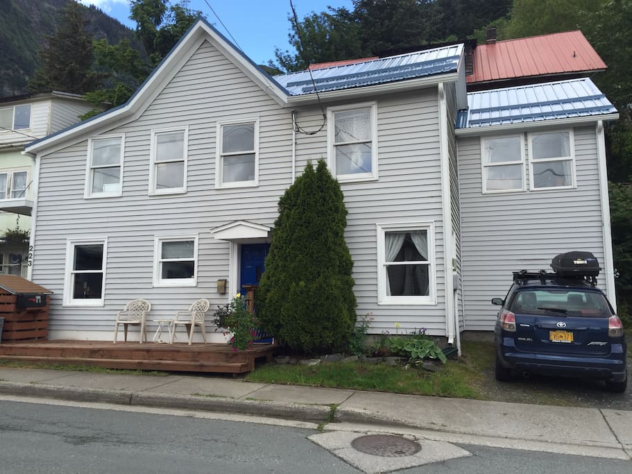 Off street parking - your parking space will be the one where the blue car is in this photo. The apartment is the entire ground level of this building. Space above is a business so you will never have to worry about late night or early morning noise from above.