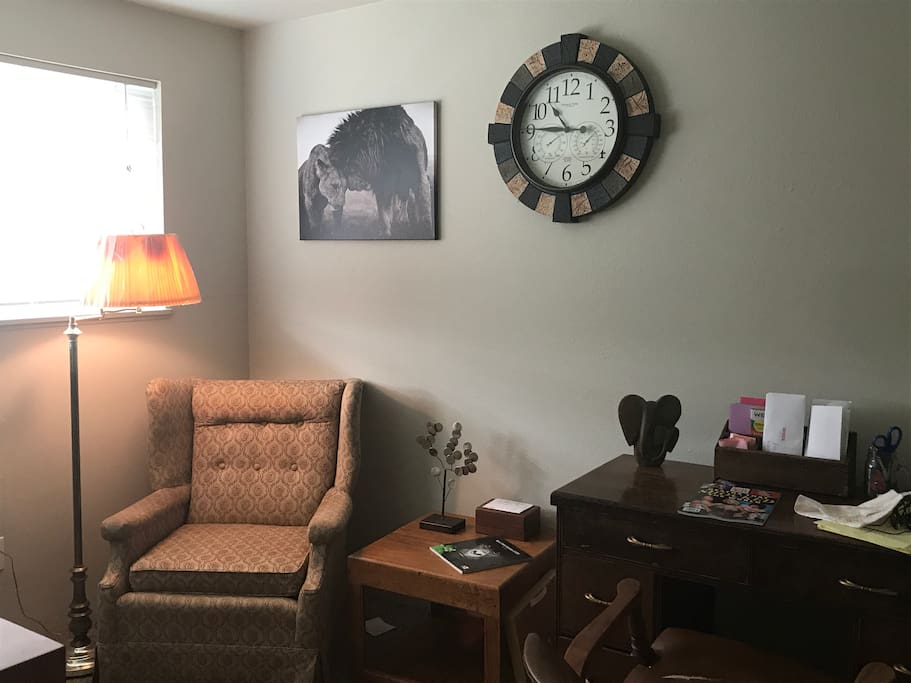 Office with antique desk and finishings and natural light! (All animals in decor are endangered and info on how you could help is around entire apt.)