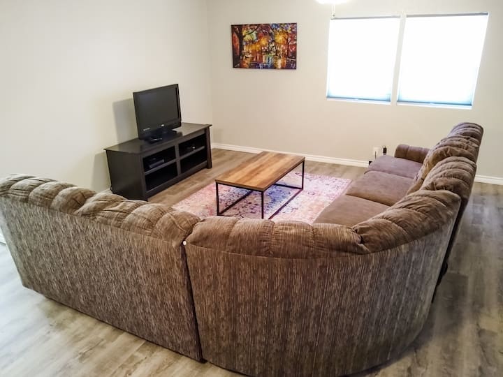 The living room has a large sectional with room to relax. The Roku TV has Netflix provided, or you can log into your own accounts.