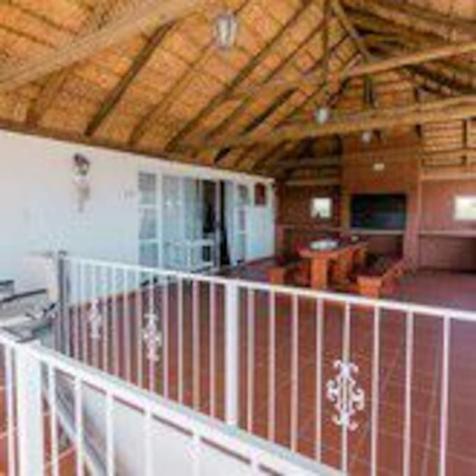 covered balcony with stunning seaview and braai with outdoor dining area