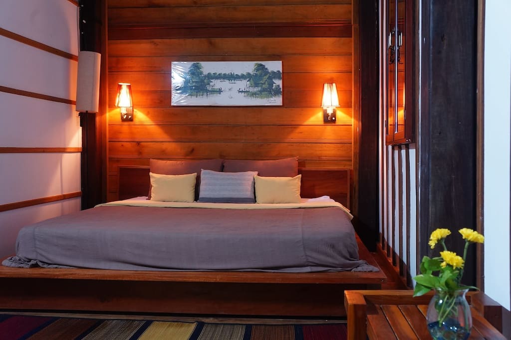 The main cozy bedroom with AC and a nice view through the window