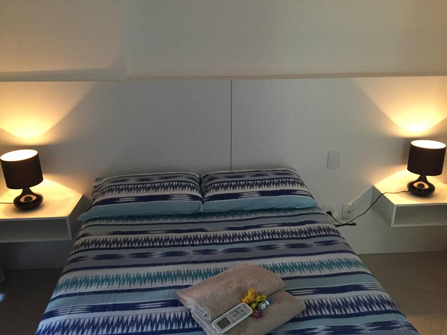 Bedroom with Queen Size bed, balcony access and Air Condition.