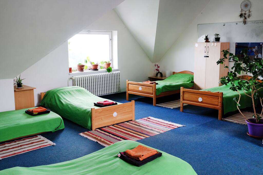 You will be sharing the attic with four more travellers from all around the world. One more double-bed is located in an adjacent room behind the curtain.