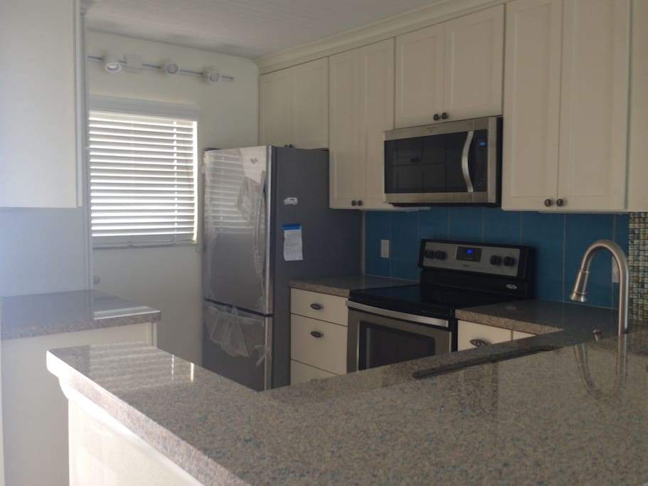 bright & cheery kitchen, all new appliances & cabinets