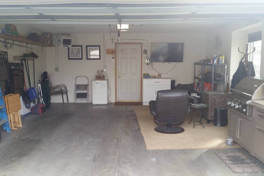 Relax in the vented, heated garage complete with T.V., refrigerator and grill cart.