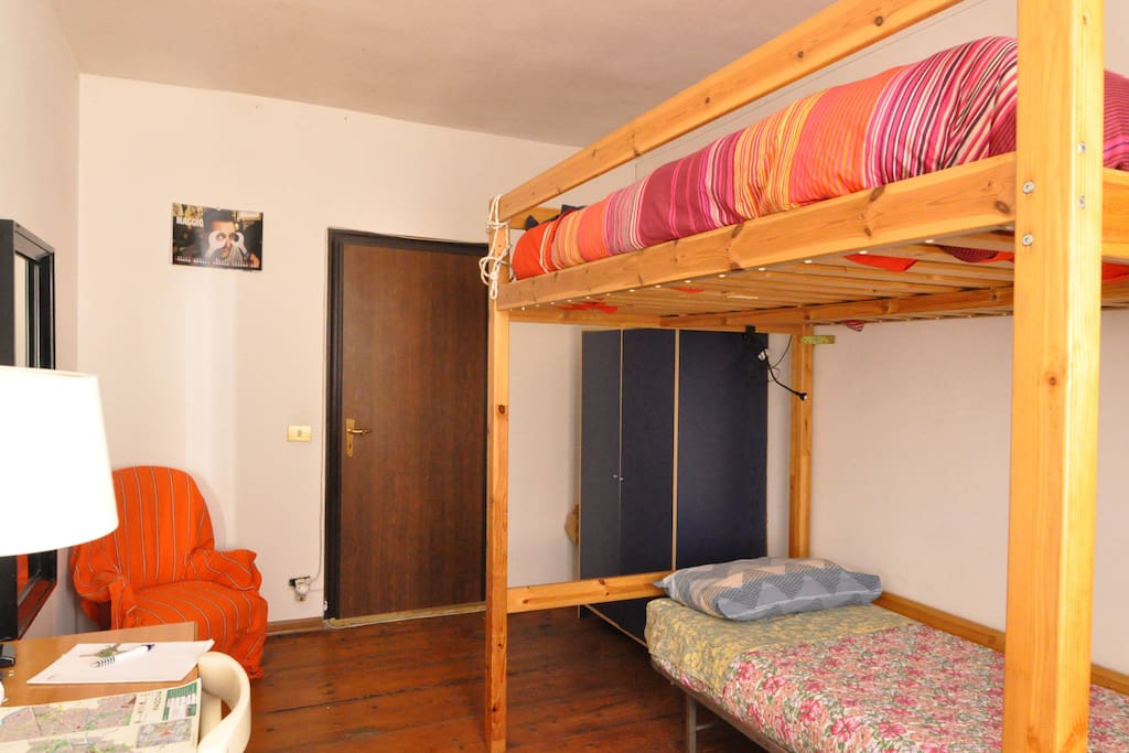 The bedroom with a double bunk bed and a single bed underneath