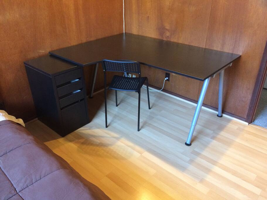 Large workspace with a nightstand